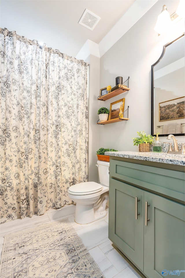 20009 Capitol Hill Dr, Tanner, AL 35671 - full bath featuring toilet, vanity, a shower with shower curtain, and marble look tile flooring