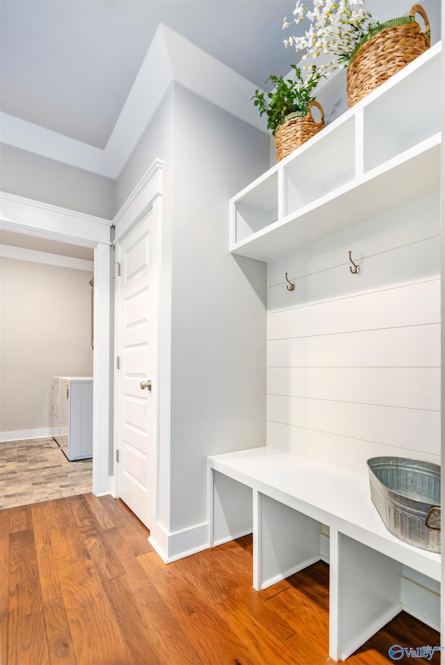 20009 Capitol Hill Dr, Tanner, AL 35671 - mudroom featuring wood finished floors, baseboards, and washer and dryer