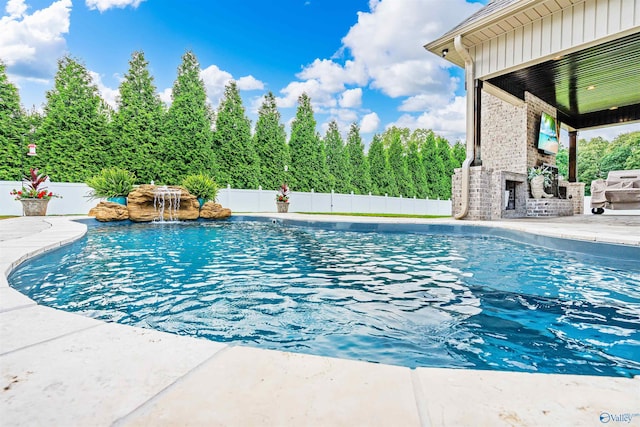 20009 Capitol Hill Dr, Tanner, AL 35671 - view of pool with an outdoor brick fireplace, a patio area, and a fenced backyard