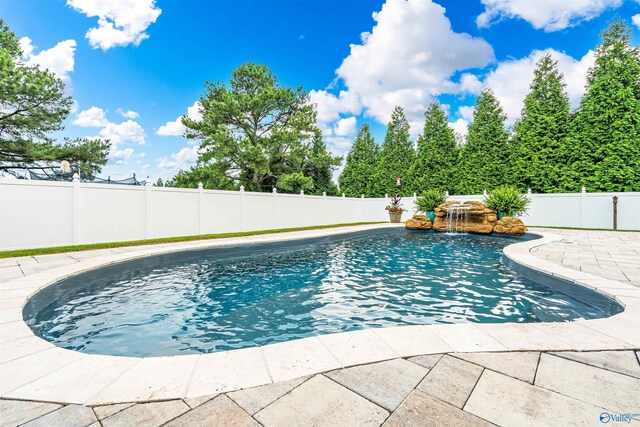 20009 Capitol Hill Dr, Tanner, AL 35671 - view of swimming pool featuring a fenced backyard and a patio area