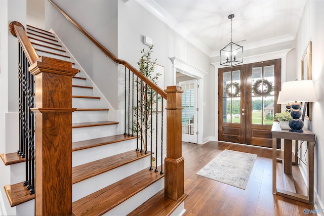 20009 Capitol Hill Dr, Tanner, AL 35671 - entryway with stairs, hardwood / wood-style flooring, a chandelier, crown molding, and baseboards
