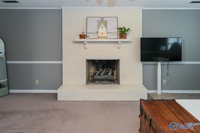 living room featuring carpet flooring, a textured ceiling, a brick fireplace, and brick wall