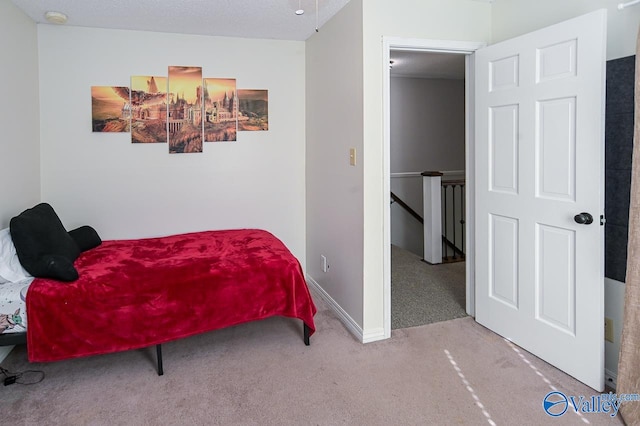 sitting room featuring a textured ceiling and carpet floors