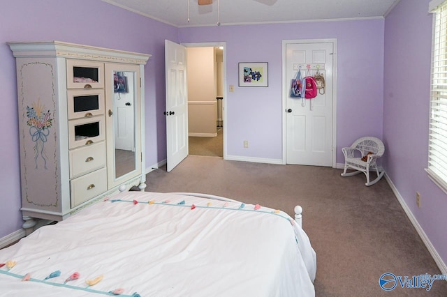 carpeted bedroom featuring ceiling fan, a closet, and multiple windows