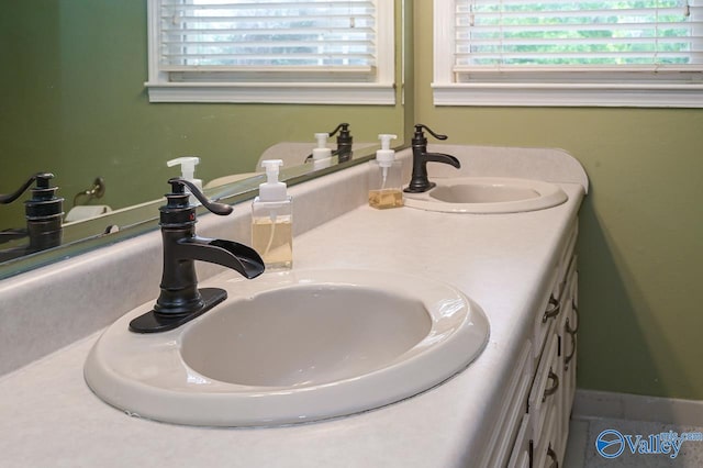 bathroom featuring double vanity