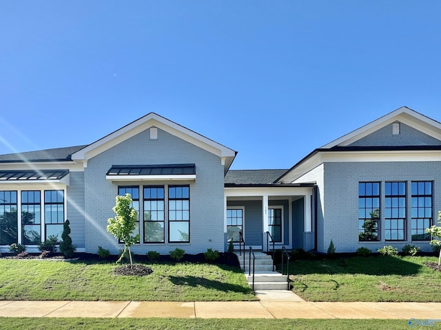 view of front of home with a front lawn