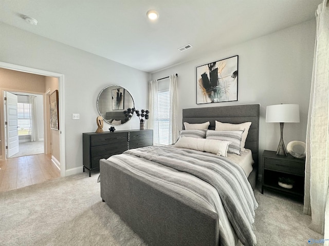 bedroom with light hardwood / wood-style flooring