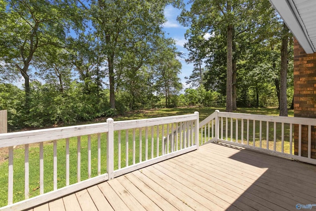 wooden deck with a yard