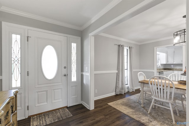 foyer featuring baseboards, dark wood-style flooring, and ornamental molding