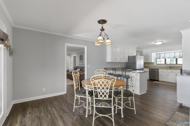 dining room with ornamental molding, dark wood-style floors, and baseboards