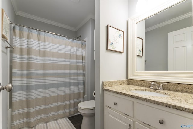 full bathroom with wood finished floors, toilet, vanity, and ornamental molding