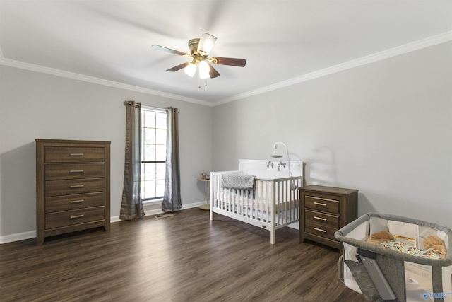 bedroom with baseboards, dark wood-style flooring, ornamental molding, and a nursery area