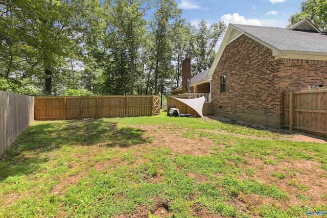 view of yard with a fenced backyard