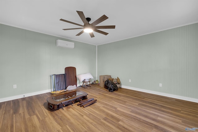 unfurnished room featuring ceiling fan, hardwood / wood-style flooring, crown molding, and a wall unit AC