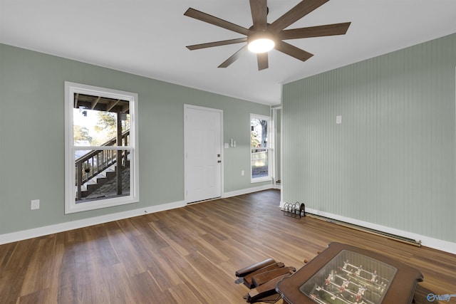 empty room featuring hardwood / wood-style flooring and ceiling fan