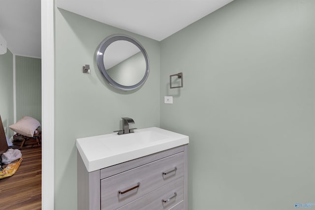 bathroom featuring vanity and wood-type flooring