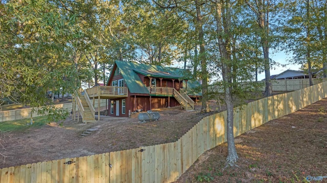 rear view of property with a deck