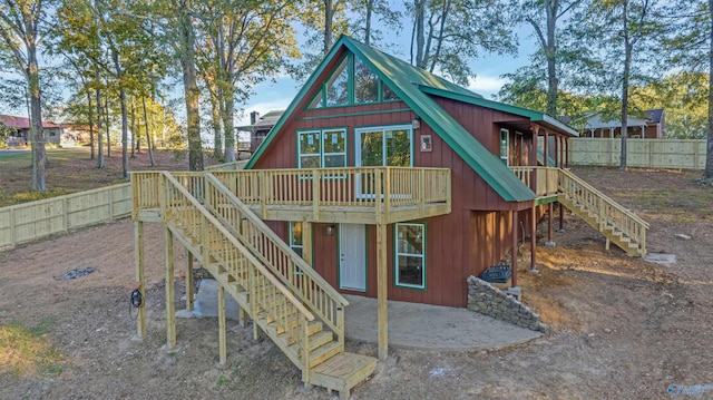 view of play area with a patio and a wooden deck