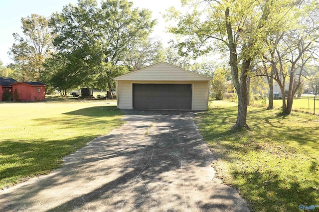 garage with a yard