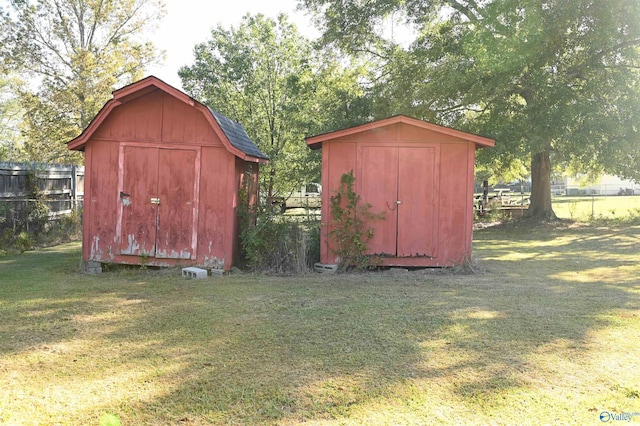 view of outbuilding featuring a yard