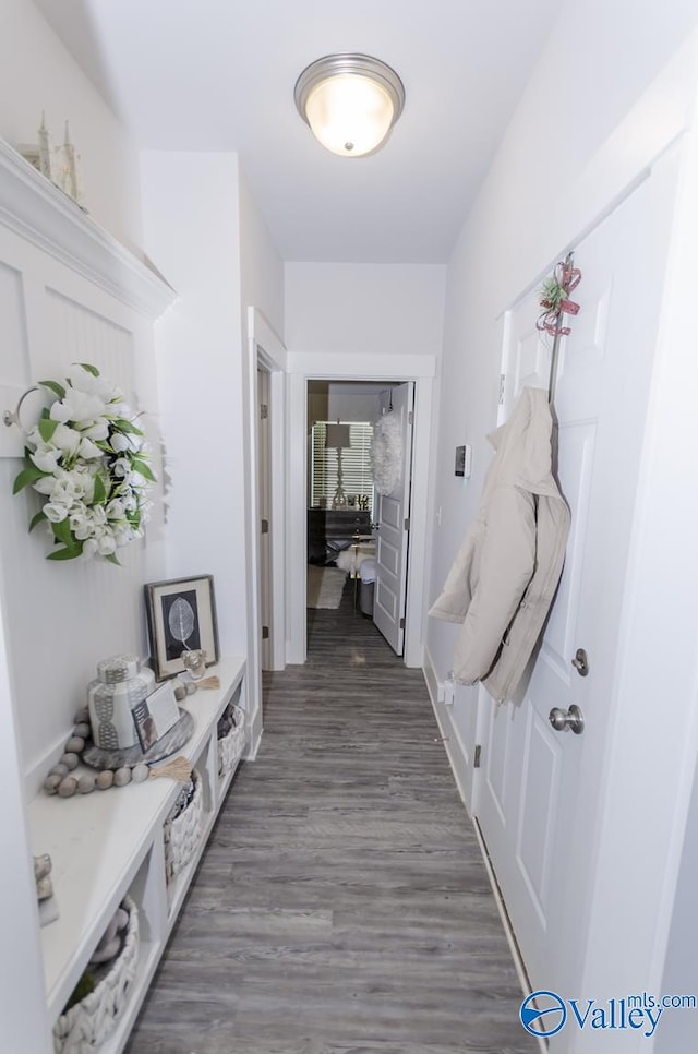 corridor featuring dark hardwood / wood-style floors