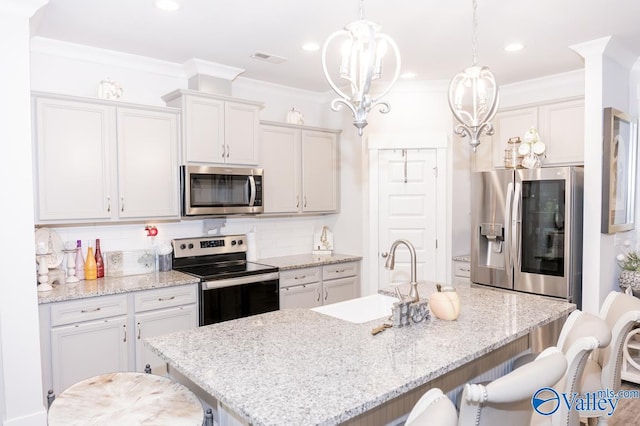 kitchen with tasteful backsplash, crown molding, decorative light fixtures, a kitchen island with sink, and appliances with stainless steel finishes