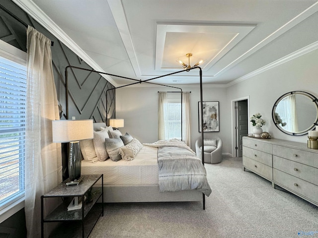 carpeted bedroom with a tray ceiling and crown molding