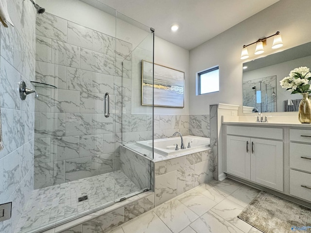 bathroom featuring a bath, marble finish floor, a stall shower, and vanity