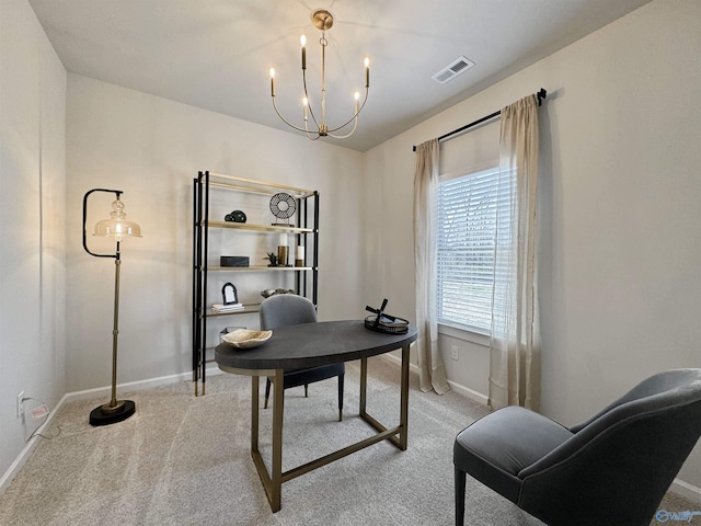 office area with light carpet, visible vents, baseboards, and a notable chandelier