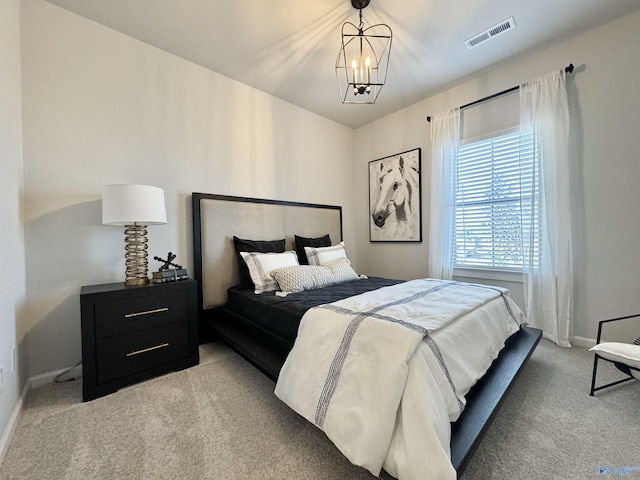 bedroom with visible vents, baseboards, light colored carpet, and a notable chandelier