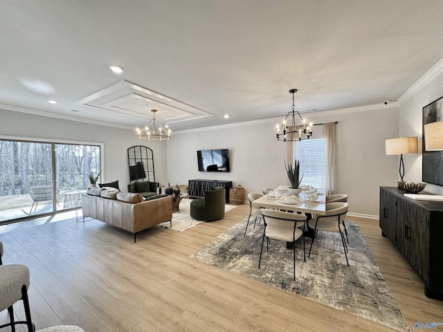 dining area with light wood finished floors, recessed lighting, crown molding, and an inviting chandelier