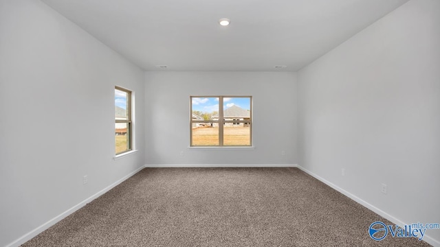 spare room featuring carpet flooring