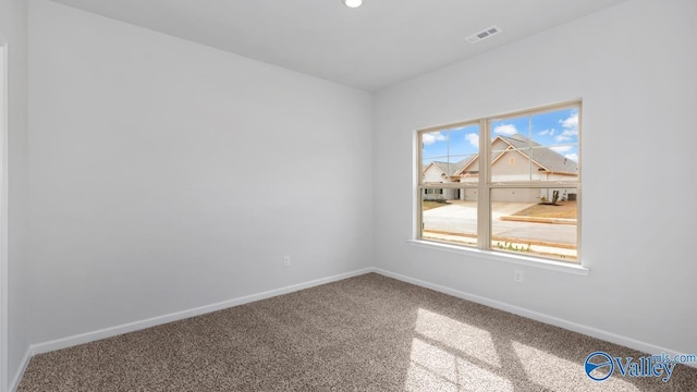 unfurnished room with carpet floors