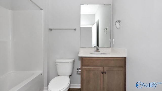 full bathroom featuring vanity, bathing tub / shower combination, and toilet