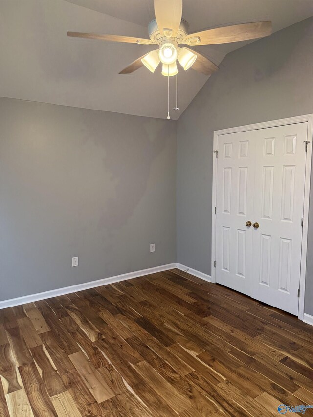 103 Katelyn Dr, Meridianville, AL 35759 - unfurnished bedroom with lofted ceiling, dark wood-style floors, ceiling fan, and a closet