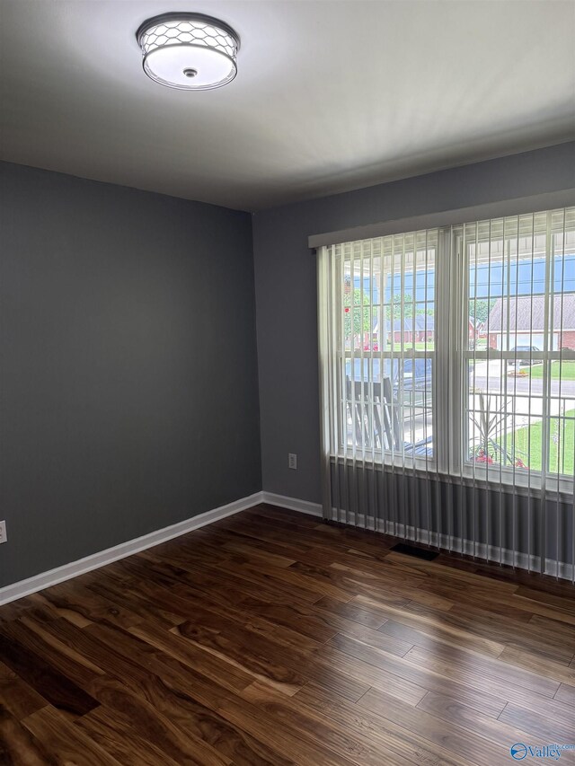 103 Katelyn Dr, Meridianville, AL 35759 - unfurnished room featuring dark wood-style floors and baseboards