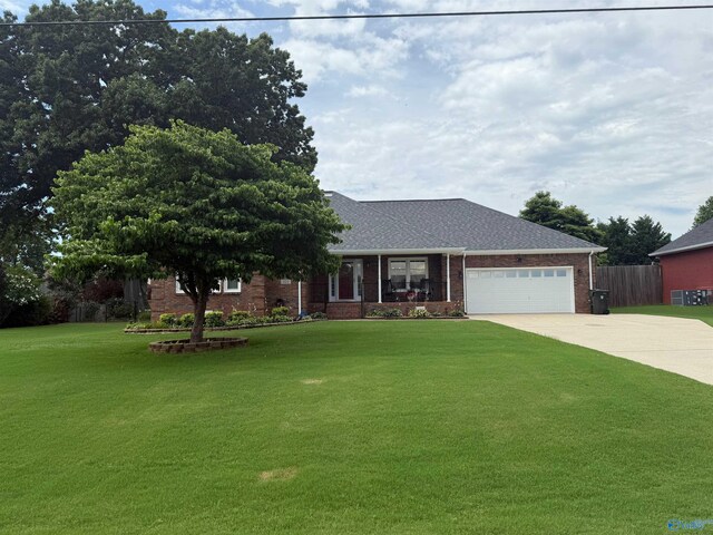 103 Katelyn Dr, Meridianville, AL 35759 - view of front of home featuring driveway, brick siding, a garage, and a shingled roof