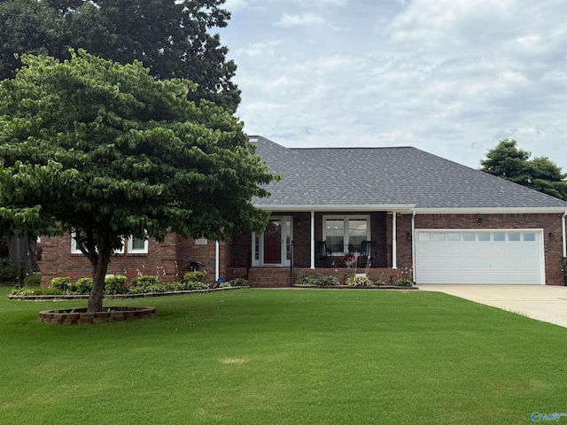 103 Katelyn Dr, Meridianville, AL 35759 - view of front of house with a front lawn, concrete driveway, and brick siding