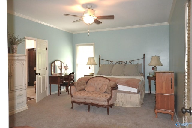 carpeted bedroom featuring ceiling fan and crown molding