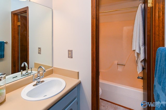 full bathroom with washtub / shower combination, vanity, and toilet