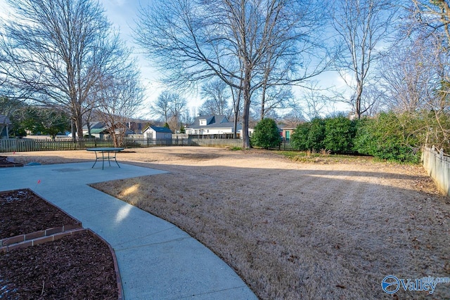 view of property's community featuring fence private yard and a patio