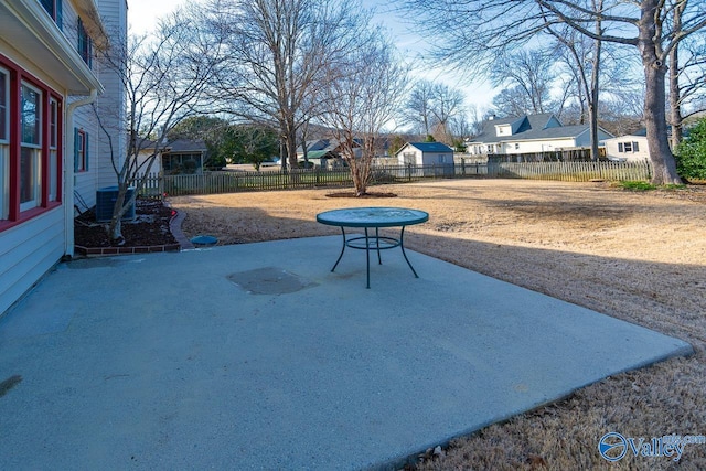 exterior space featuring fence private yard, a patio area, and a residential view