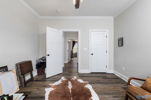 unfurnished room featuring dark hardwood / wood-style floors, crown molding, and ceiling fan