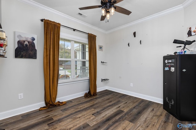 bedroom with dark wood-type flooring, ceiling fan, and crown molding