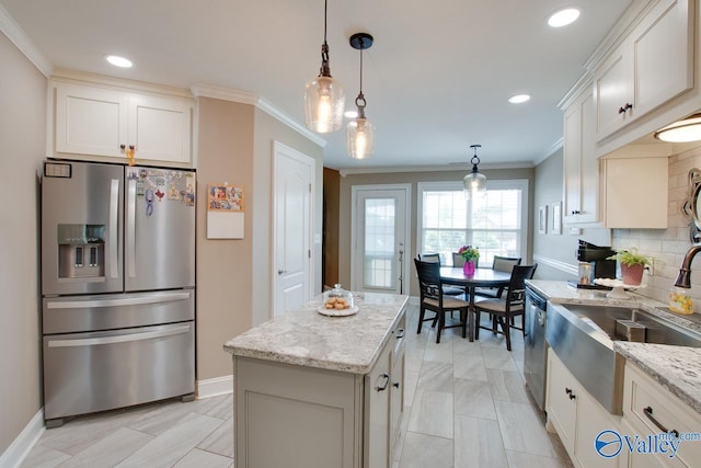 16675 Bellewood Dr, Athens, AL 35613 - kitchen with stainless steel appliances, a sink, crown molding, light stone countertops, and pendant lighting