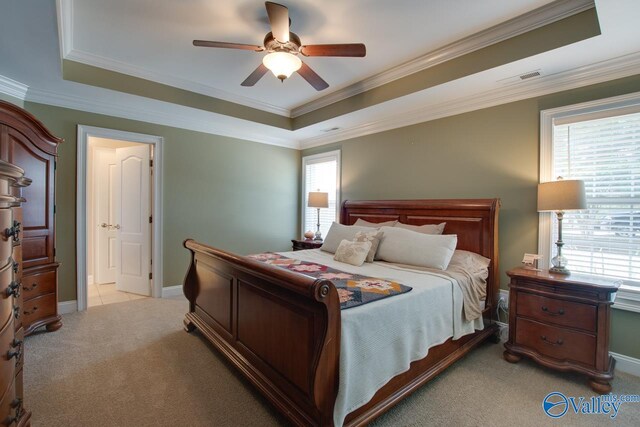 16675 Bellewood Dr, Athens, AL 35613 - bedroom featuring light colored carpet, a raised ceiling, multiple windows, and crown molding