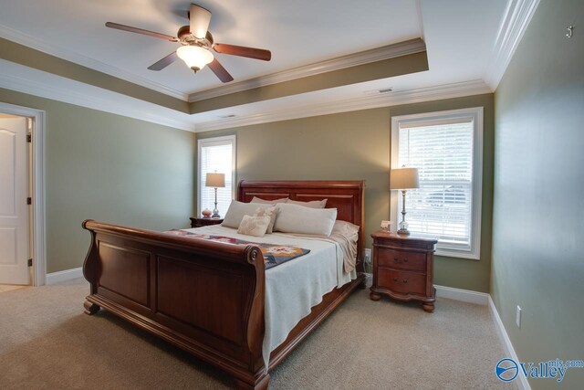 16675 Bellewood Dr, Athens, AL 35613 - bedroom featuring light carpet, a tray ceiling, ornamental molding, baseboards, and ceiling fan