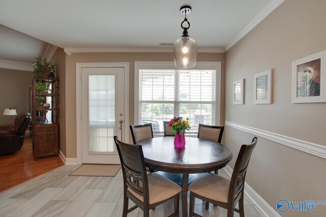 16675 Bellewood Dr, Athens, AL 35613 - dining area with crown molding and baseboards