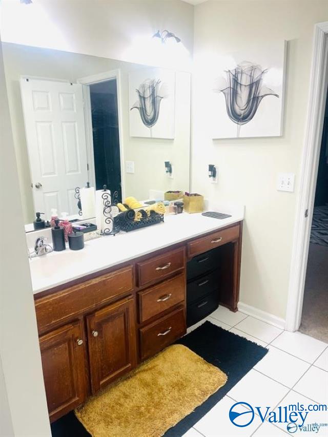 bathroom with vanity and tile patterned floors