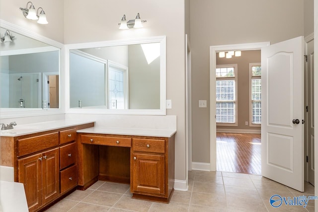 bathroom featuring vanity, tile patterned flooring, and an enclosed shower